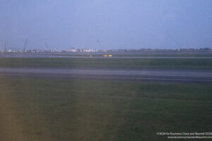 a runway with lights in the distance