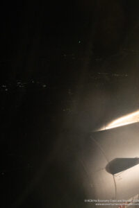 a plane wing in the sky