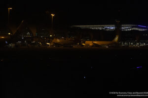 a plane parked at night