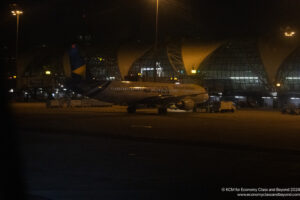 an airplane on the runway at night
