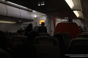 a group of people sitting in an airplane