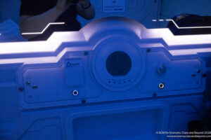 a white machine with a round dial and buttons