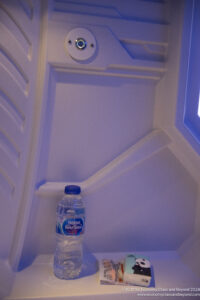 a plastic bottle of water in a white room