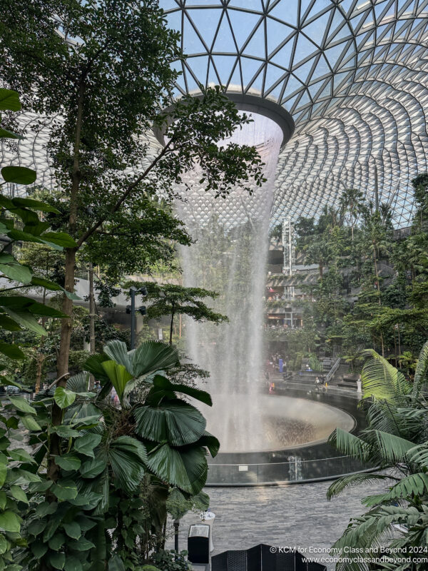 a water fall in a glass dome