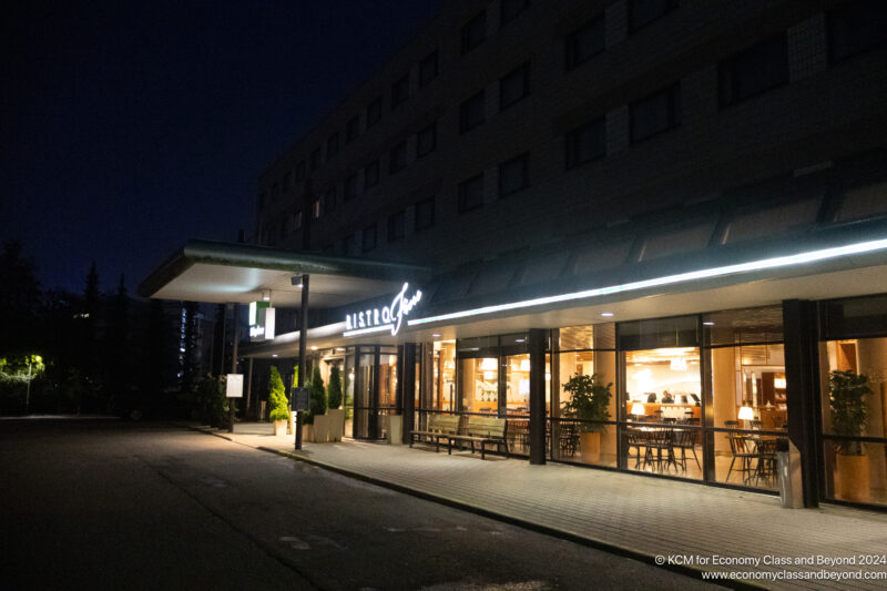 a building with a restaurant in the front at night