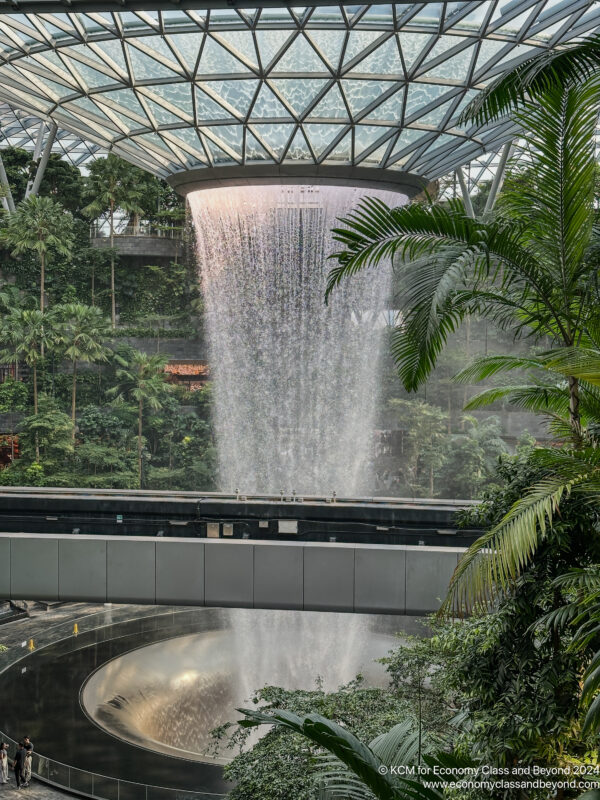 a water falling from a glass ceiling