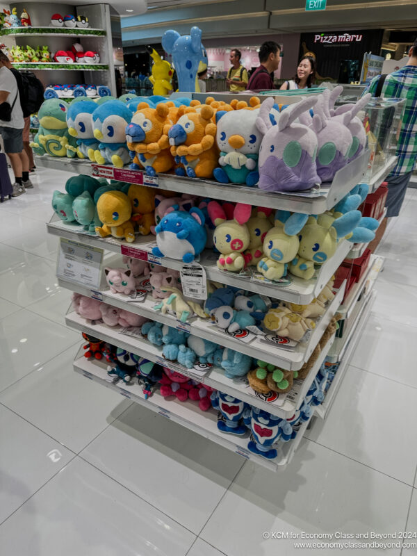 a shelf with stuffed animals on it