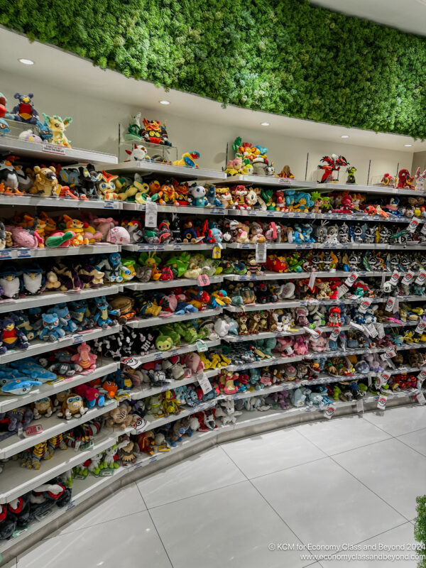 a shelf with many stuffed animals