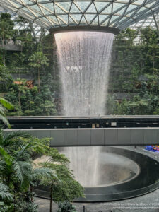 a waterfall in a glass dome