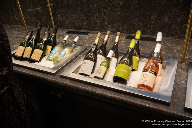 a row of bottles of wine on ice