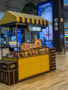 a yellow and black stand with yellow and black striped awning