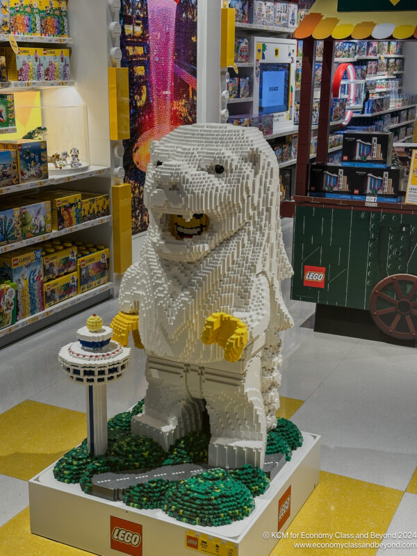 a white animal made of legos in a store