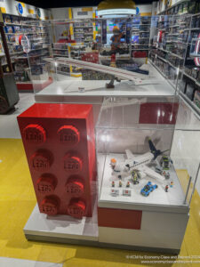 a display case with legos and model planes