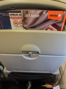 a seat with a magazine in it