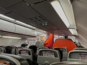 a group of people sitting in an airplane