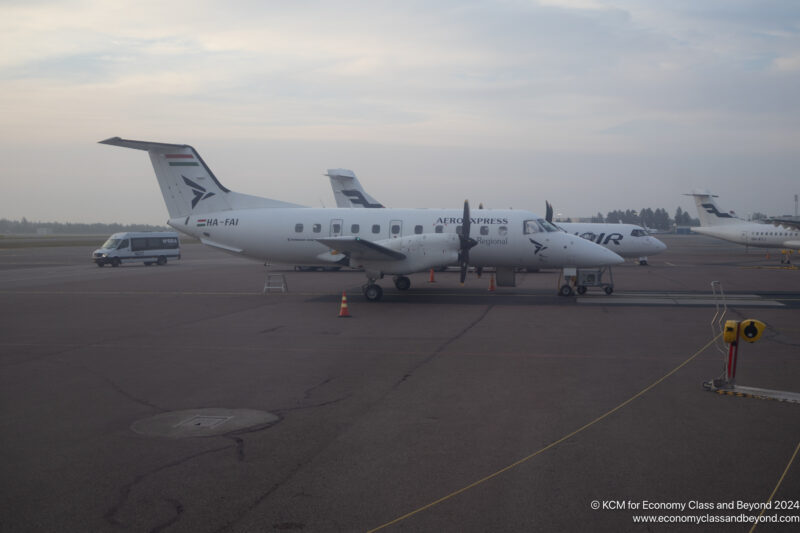 a group of airplanes on a runway