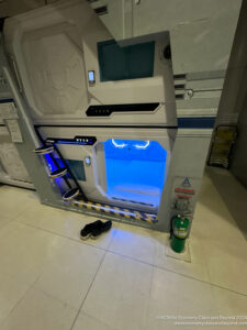 a room with a door and a fire extinguisher