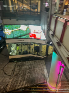 a building with a glass wall and a staircase