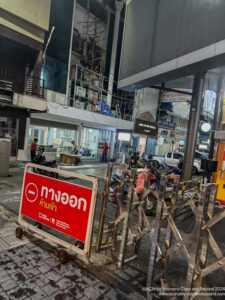 a building with scaffolding and a sign