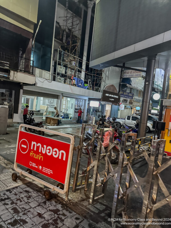 a building with scaffolding and a sign