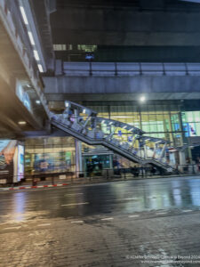 a walkway with a staircase in the middle of a street