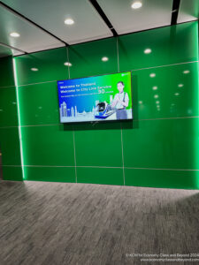 a green wall with a television on it