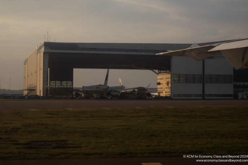 a building with airplanes in the background