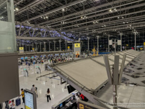 a large airport with people walking around