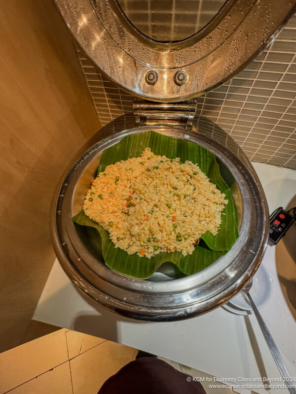 a bowl of rice with a lid open