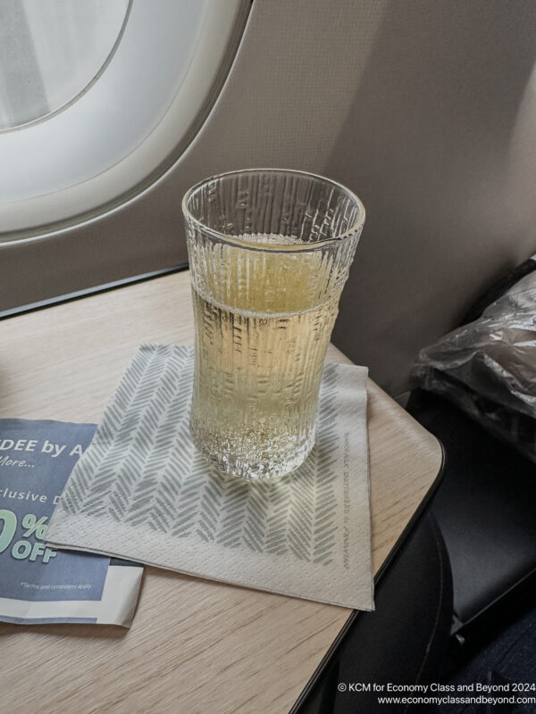 a glass of liquid on a table