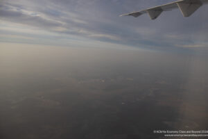 an airplane wing in the sky