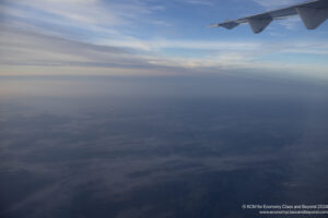 an airplane wing in the sky