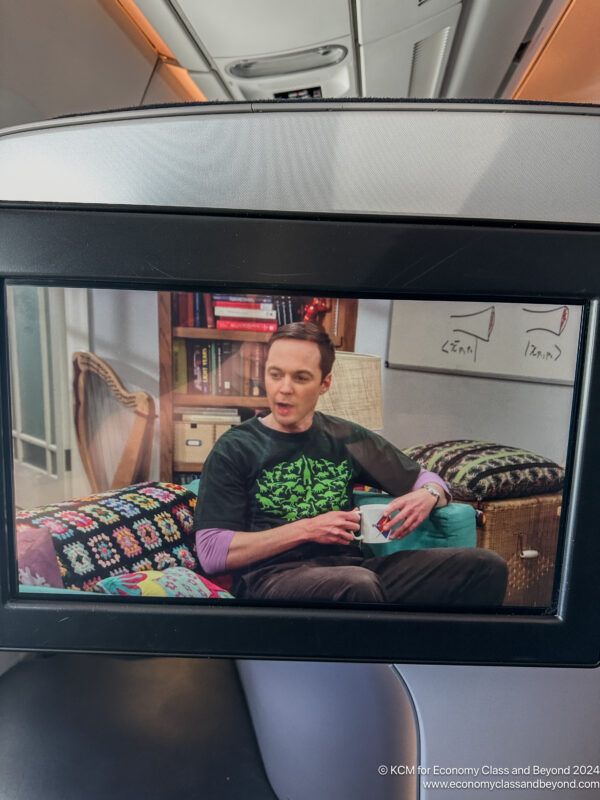 a man sitting on a television screen