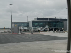 a building with a glass facade and a walkway