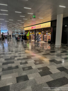 a group of people walking in a airport