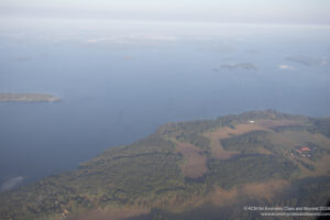 an aerial view of land and water