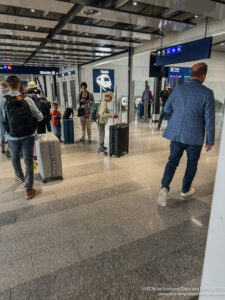 a group of people walking in a terminal