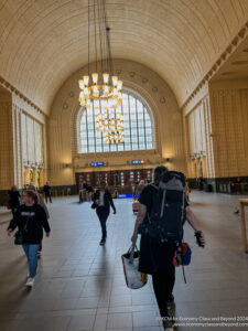 a group of people walking in a large building