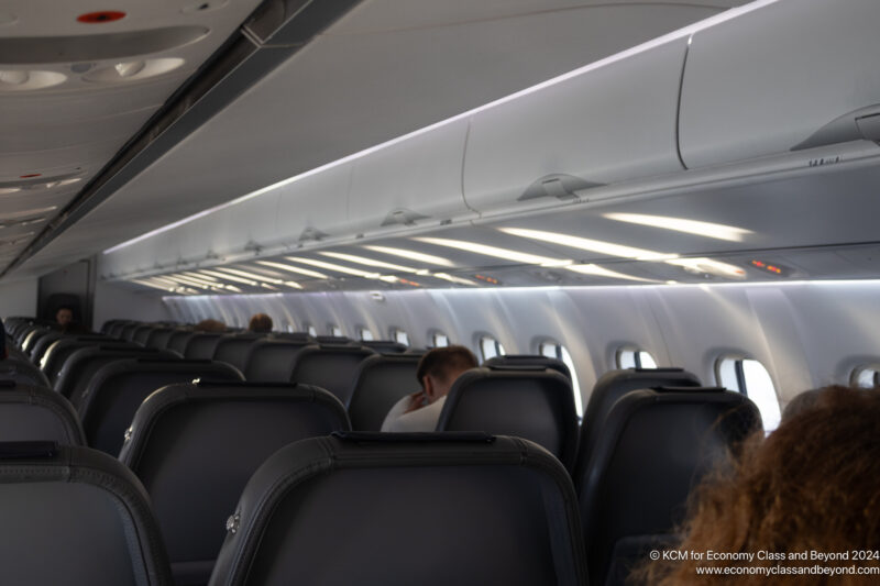 a group of people sitting in an airplane