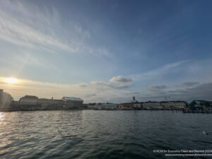 a body of water with buildings in the background