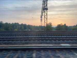 train tracks with trees in the background