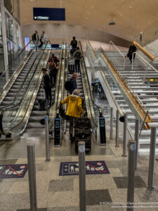 a group of people on an escalator