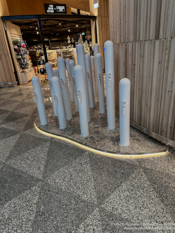 a sculpture of white poles