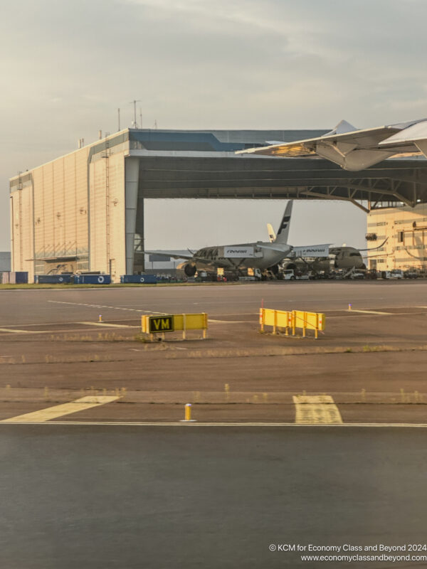 an airport with airplanes in the background