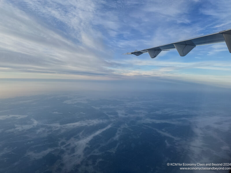 an airplane wing in the sky