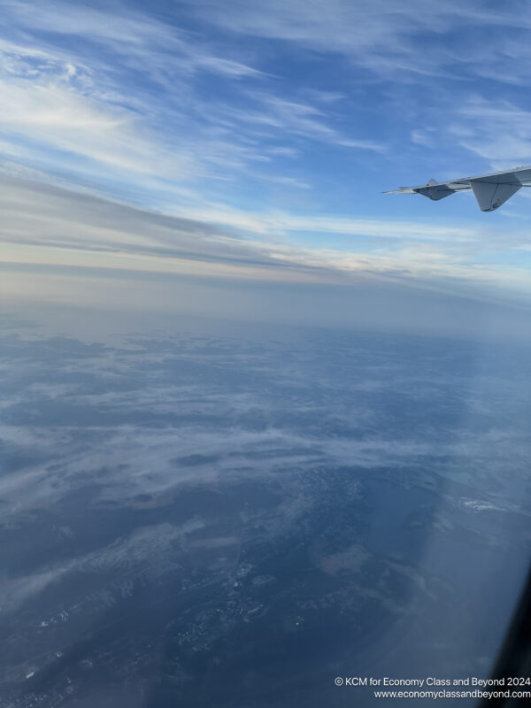 an airplane wing in the sky