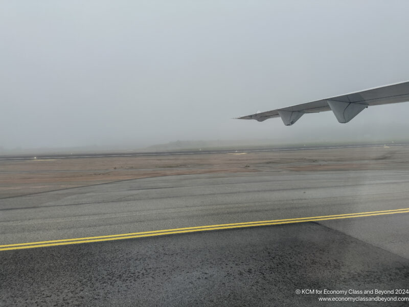 an airplane wing on a runway