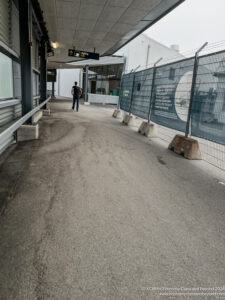 a person walking on a sidewalk