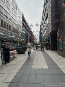 a person walking down a sidewalk