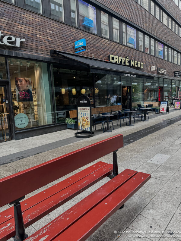 a red bench outside a store